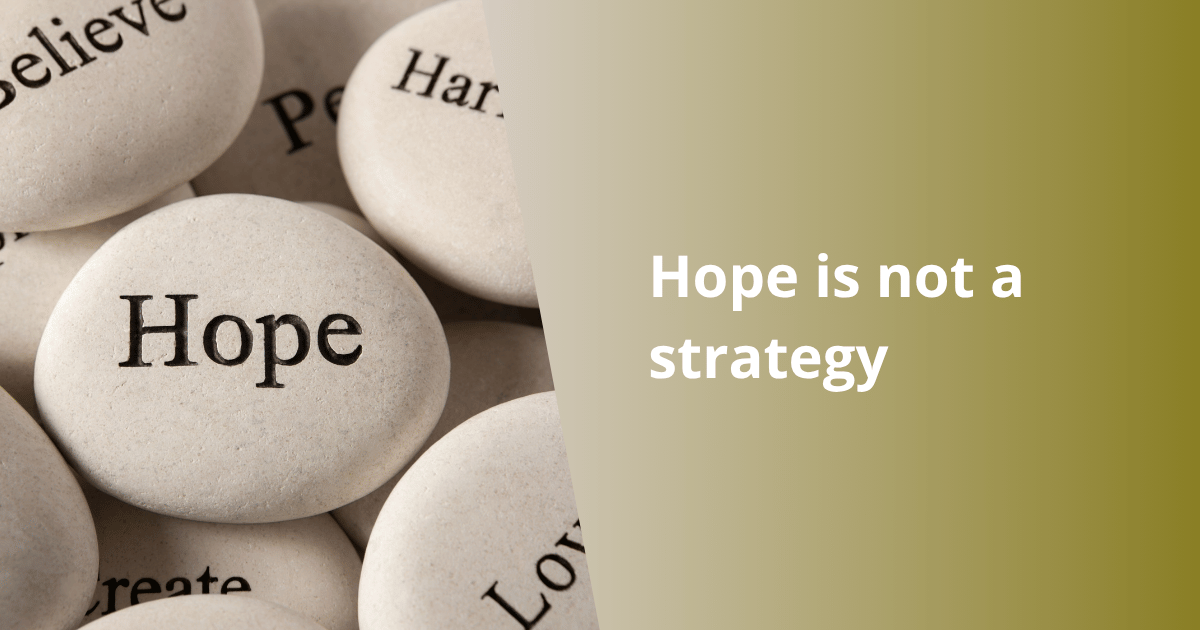 <h1 class="wp-block-heading has-x-large-font-size"><strong>Hope Is Not a Strategy?</strong></h1>
<p class="wp-block-paragraph"></p>
<p class="wp-block-paragraph">Nigeria was once described as one of the happiest nations on earth. Although changing economic and social realities may have weakened that reputation, the expression “suffering and smiling” still captures something remarkable about the Nigerian spirit.</p>
<p class="wp-block-paragraph">It describes the ability to endure hardship without surrendering one’s humour, warmth, or hope. It is a quality that deserves admiration. Yet it also raises an uncomfortable question: when does resilience help a society move forward, and when does it merely help people tolerate what should never have been accepted?</p>
<p class="wp-block-paragraph">Across Nigeria, one can witness extraordinary examples of human endurance.</p>
<p class="wp-block-paragraph">Imagine a man pushing a wheelbarrow loaded with goods several times his own weight. The afternoon sun is unforgiving. Sweat runs down his face and soaks through his clothes as he manoeuvres through a crowded street. His work is physically exhausting, and the money he earns may barely support his family.</p>
<p class="wp-block-paragraph">One might expect frustration to be written across his face. Instead, he exchanges jokes with another trader, laughs at a passing comment, and continues on his way.</p>
<p class="wp-block-paragraph">That scene says something powerful about human behaviour. People do not survive difficult circumstances through physical strength alone. They also survive through relationships, humour, optimism, faith, and the ability to find small moments of happiness in otherwise harsh conditions.</p>
<p class="wp-block-paragraph">These emotional coping mechanisms are not signs of ignorance or weakness. They are tools of survival.</p>
<p class="wp-block-paragraph">However, every survival mechanism has a hidden danger. The same capacity that helps people endure a bad situation may also reduce the urgency to change it.</p>
<h2 class="wp-block-heading has-large-font-size"><strong>The Comfort Within Discomfort</strong></h2>
<p class="wp-block-paragraph">For decades, many communities in Nigeria have experienced unreliable electricity. Fans, refrigerators, water pumps, computers, and medical equipment cannot reasonably be considered luxuries in a modern society. They are essential to health, education, productivity, and economic development.</p>
<p class="wp-block-paragraph">Yet people have learned to adapt.</p>
<p class="wp-block-paragraph">Families buy generators when they can afford them. Businesses install inverters or solar systems. Residents sleep through hot nights while joking about mosquitoes performing concerts around their ears. When electricity suddenly returns, even briefly, people celebrate with the familiar cry of “Up NEPA!”</p>
<p class="wp-block-paragraph">The celebration is understandable. After hours or days of darkness, the restoration of power feels like a gift.</p>
<p class="wp-block-paragraph">But electricity is not supposed to be a gift. It is a basic service.</p>
<p class="wp-block-paragraph">This is where human adaptation becomes complicated. When people repeatedly experience poor service, they gradually adjust their expectations. What should be considered unacceptable begins to feel normal. A few minutes of electricity appear generous because the standard has fallen so low.</p>
<blockquote class="wp-block-quote is-layout-flow wp-block-quote-is-layout-flow">
<p class="wp-block-paragraph"><strong>Psychologists sometimes describe a related tendency as adaptation. Human beings become accustomed to both comfort and discomfort. We learn to function within the conditions around us, even when those conditions are far from ideal.</strong></p>
</blockquote>
<p class="wp-block-paragraph">Adaptation helps us survive. Evolution, however, requires more than survival.</p>
<p class="wp-block-paragraph">Evolution begins when we ask whether the conditions to which we have adapted should continue to exist.</p>
<h2 class="wp-block-heading has-large-font-size"><strong>Happiness and the Desire for Change</strong></h2>
<p class="wp-block-paragraph">This leads to a difficult management and social question:</p>
<p class="wp-block-paragraph"><em>Can people remain sufficiently motivated to demand improvement when they have become skilled at remaining happy under poor conditions?</em></p>
<p class="wp-block-paragraph">Happiness itself is not the problem. No society should have to become permanently angry or miserable before it can progress. Humour, joy, and community are valuable human qualities.</p>
<p class="wp-block-paragraph">The danger arises when happiness becomes passive acceptance.</p>
<p class="wp-block-paragraph">There is an important difference between saying, “Life is difficult, but I will not allow it to destroy me,” and saying, “Life is difficult, but nothing can be done about it.”</p>
<p class="wp-block-paragraph">The first response is resilience. The second is resignation.</p>
<blockquote class="wp-block-quote is-layout-flow wp-block-quote-is-layout-flow">
<p class="wp-block-paragraph"><strong>They may look similar from the outside because both people continue with their lives. Internally, however, they are completely different. Resilience preserves the energy needed for action. Resignation slowly removes the belief that action is worthwhile.</strong></p>
</blockquote>
<p class="wp-block-paragraph">A healthy society needs citizens who can smile through hardship while still insisting that the hardship be corrected. It needs people who can maintain hope without allowing hope to replace accountability.</p>
<h2 class="wp-block-heading has-large-font-size"><strong>When Waiting Becomes Normal</strong></h2>
<p class="wp-block-paragraph">I once visited a commercial bank where a long line of customers was being served by a single teller. A simple withdrawal could take almost an hour.</p>
<p class="wp-block-paragraph">The customers in the queue did not appear particularly agitated. A television behind the counter was showing a European football match. People discussed the game, debated the players’ performances, laughed with one another, and slowly moved forward as the line crawled along.</p>
<p class="wp-block-paragraph">Their behaviour was admirable in one sense. They had found a way to turn an irritating delay into a social experience. Rather than spending an hour in visible anger, they used conversation and football to make the wait more bearable.</p>
<p class="wp-block-paragraph">But the bank could also interpret their patience incorrectly.</p>
<blockquote class="wp-block-quote is-layout-flow wp-block-quote-is-layout-flow">
<p class="wp-block-paragraph"><strong>Management might conclude that the customers were satisfied. Since few people complained, the branch might see no urgent reason to open another counter, improve staffing, introduce better technology, or redesign the service process. Silence can easily be mistaken for satisfaction.</strong></p>
</blockquote>
<p class="wp-block-paragraph">This happens in many businesses. Customers may tolerate poor service not because they approve of it, but because they believe complaining will make no difference. They may smile politely, complete the transaction, and never return.</p>
<p class="wp-block-paragraph">A retailer may see customers waiting patiently at the billing counter and assume everything is fine. In reality, some customers may be mentally deciding to shop elsewhere next time. A restaurant may notice diners joking while their food is delayed and conclude that the delay is acceptable. Yet those diners may later leave a poor review or quietly avoid the restaurant.</p>
<p class="wp-block-paragraph">Businesses must therefore look beyond visible behaviour.</p>
<blockquote class="wp-block-quote is-layout-flow wp-block-quote-is-layout-flow">
<p class="wp-block-paragraph"><strong>A smiling customer is not necessarily a satisfied customer. A quiet employee is not necessarily an engaged employee. A team that continues meeting deadlines is not necessarily functioning well. People often develop coping mechanisms long before leaders recognize that a system is failing them.</strong></p>
</blockquote>
<p class="wp-block-paragraph">Good management does not ask only, “Are people managing?”</p>
<p class="wp-block-paragraph">It asks, “Why are they being forced to manage this way?”</p>
<h2 class="wp-block-heading has-large-font-size"><strong>Coping Mechanisms in the Workplace</strong></h2>
<p class="wp-block-paragraph">The same pattern appears inside organisations.</p>
<p class="wp-block-paragraph">Employees often adapt to inefficient systems. They create unofficial spreadsheets because the company software does not work properly. They use personal messaging applications because official communication channels are slow. They remain late at the office because approval processes are badly designed.</p>
<p class="wp-block-paragraph">Over time, these workarounds become part of the company culture.</p>
<p class="wp-block-paragraph">Management may even praise such employees for their dedication and resourcefulness. Yet constant improvisation is not always evidence of a strong organisation. Sometimes it is evidence that the formal system has failed.</p>
<p class="wp-block-paragraph">Imagine a retail store where the inventory records are unreliable. Experienced salespeople may know where products are kept and which items are probably available. They call colleagues, search the stockroom, and somehow complete the sale.</p>
<p class="wp-block-paragraph">The customer leaves with the product, so the problem appears to have been solved.</p>
<p class="wp-block-paragraph">But nothing has actually improved. The next customer will face the same delay. A new employee will struggle because the knowledge exists only in the minds of senior staff. Management may continue hoping that experienced employees will “handle it.”</p>
<p class="wp-block-paragraph">That is not a strategy. It is dependence disguised as resilience.</p>
<p class="wp-block-paragraph">A real strategy would involve correcting inventory records, improving product labelling, training employees, assigning responsibility, and measuring stock accuracy.</p>
<p class="wp-block-paragraph">Hope says, “Our team will find a way.”</p>
<p class="wp-block-paragraph">Strategy asks, “Why must our team keep finding a way around the same problem?”</p>
<h2 class="wp-block-heading has-large-font-size"><strong>Humour as Social Medicine</strong></h2>
<p class="wp-block-paragraph">Nigerians have also mastered the art of using humour to discuss national problems. Jokes about electricity, traffic, government offices, banks, roads, fuel shortages, and public officials circulate quickly through conversations and social media.</p>
<p class="wp-block-paragraph">Such humour performs an important social function. It reduces emotional pressure. It allows people to discuss painful realities without being overwhelmed by them. Satire can reveal truths that formal speeches often hide.</p>
<p class="wp-block-paragraph">Humour is, in many ways, a form of social medicine.</p>
<p class="wp-block-paragraph">But medicine should not be confused with a cure.</p>
<p class="wp-block-paragraph">A joke about a pothole may help a commuter survive a frustrating journey, but it does not repair the road. A humorous story about corruption may expose the absurdity of the system, but it does not create accountability. Satire can awaken people, but it can also make dysfunction feel familiar and therefore less shocking.</p>
<p class="wp-block-paragraph"><strong>When every failure becomes a joke, outrage may eventually lose its force.</strong></p>
<p class="wp-block-paragraph">The challenge is to allow humour to preserve our humanity without allowing it to weaken our demand for improvement.</p>
<h2 class="wp-block-heading has-large-font-size"><strong>Hope Needs Structure</strong></h2>
<p class="wp-block-paragraph">Hope is essential. Without it, people stop trying. Entrepreneurs would not start businesses, employees would not pursue new opportunities, and societies would not imagine a better future.</p>
<p class="wp-block-paragraph">But hope must be connected to action.</p>
<p class="wp-block-paragraph">A struggling retailer may hope that sales improve during the festive season. A strategic retailer studies customer behaviour, improves merchandising, plans promotions, trains the sales team, manages inventory, and creates measurable targets.</p>
<p class="wp-block-paragraph">A business owner may hope that customers remain loyal. A strategic owner regularly asks customers what they value, corrects service failures, improves product quality, and gives people a reason to return.</p>
<p class="wp-block-paragraph">A government may hope that economic conditions improve. Strategy requires policies, competent execution, transparent measurement, and accountability when promises are not fulfilled.</p>
<p class="wp-block-paragraph">The difference is simple:</p>
<p class="wp-block-paragraph"><strong>Hope imagines the destination. Strategy builds the road.</strong></p>
<p class="wp-block-paragraph">Hope gives us emotional energy, but accountability gives that energy direction. Without accountability, hope becomes an excuse for waiting. Without action, optimism becomes a comforting story we tell ourselves while the same problems continue.</p>
<h2 class="wp-block-heading has-large-font-size"><strong>From Endurance to Evolution</strong></h2>
<p class="wp-block-paragraph">Nigeria’s ability to survive hardship is extraordinary. The warmth, humour, faith, creativity, and adaptability of its people are genuine national strengths.</p>
<p class="wp-block-paragraph">But strengths must evolve.</p>
<p class="wp-block-paragraph">The next stage of social evolution is not to abandon happiness or resilience. It is to combine them with higher expectations. Nigerians should not have to choose between smiling and demanding better governance. Customers should not have to choose between patience and better service. Employees should not have to choose between loyalty and speaking honestly about broken systems.</p>
<p class="wp-block-paragraph">True evolution occurs when coping is transformed into correction.</p>
<p class="wp-block-paragraph">It happens when people stop celebrating basic services as favours and begin recognising them as standards. It happens when businesses stop admiring employees for surviving inefficient systems and begin redesigning those systems. It happens when citizens move beyond hoping that leaders will improve and begin demanding evidence, transparency, and results.</p>
<p class="wp-block-paragraph">Hope should remain alive. It should inspire us, encourage us, and remind us that tomorrow can be better than today.</p>
<p class="wp-block-paragraph">But hope cannot carry the entire burden of progress.</p>
<p class="wp-block-paragraph">For individuals, organisations, and nations, hope must be supported by action, measurement, responsibility, and zero tolerance for repeated failure.</p>
<p class="wp-block-paragraph">We may continue smiling. We may continue joking. We may continue believing in a better tomorrow.</p>
<p class="wp-block-paragraph">But we must also plan, question, participate, and hold those in authority accountable.</p>
<p class="wp-block-paragraph"><strong>Because hope can begin a journey. It cannot be the strategy that completes it.</strong></p>